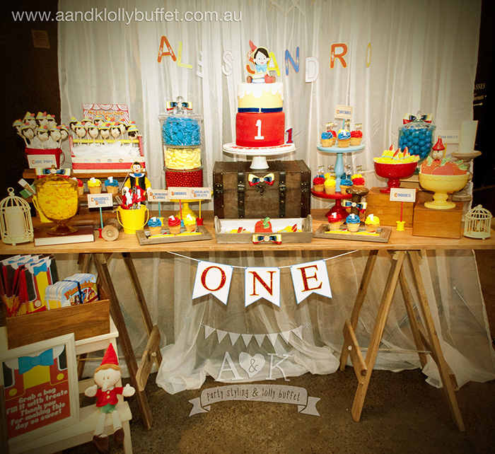 Alessandro's vintage rustic Pinocchio themed 1st birthday party dessert table by A&K Lolly Buffet