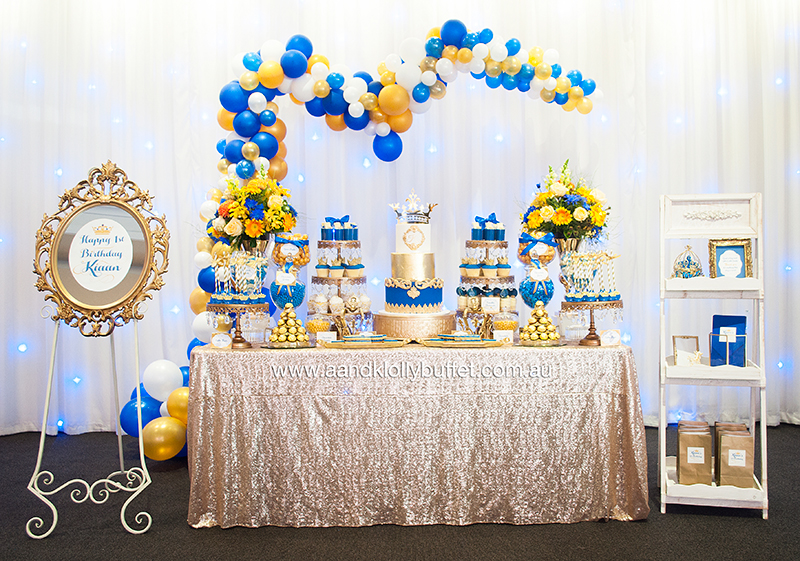 Kiaan's Royal Blue & Gold 1st Birthday dessert table by A&K Lolly Buffet